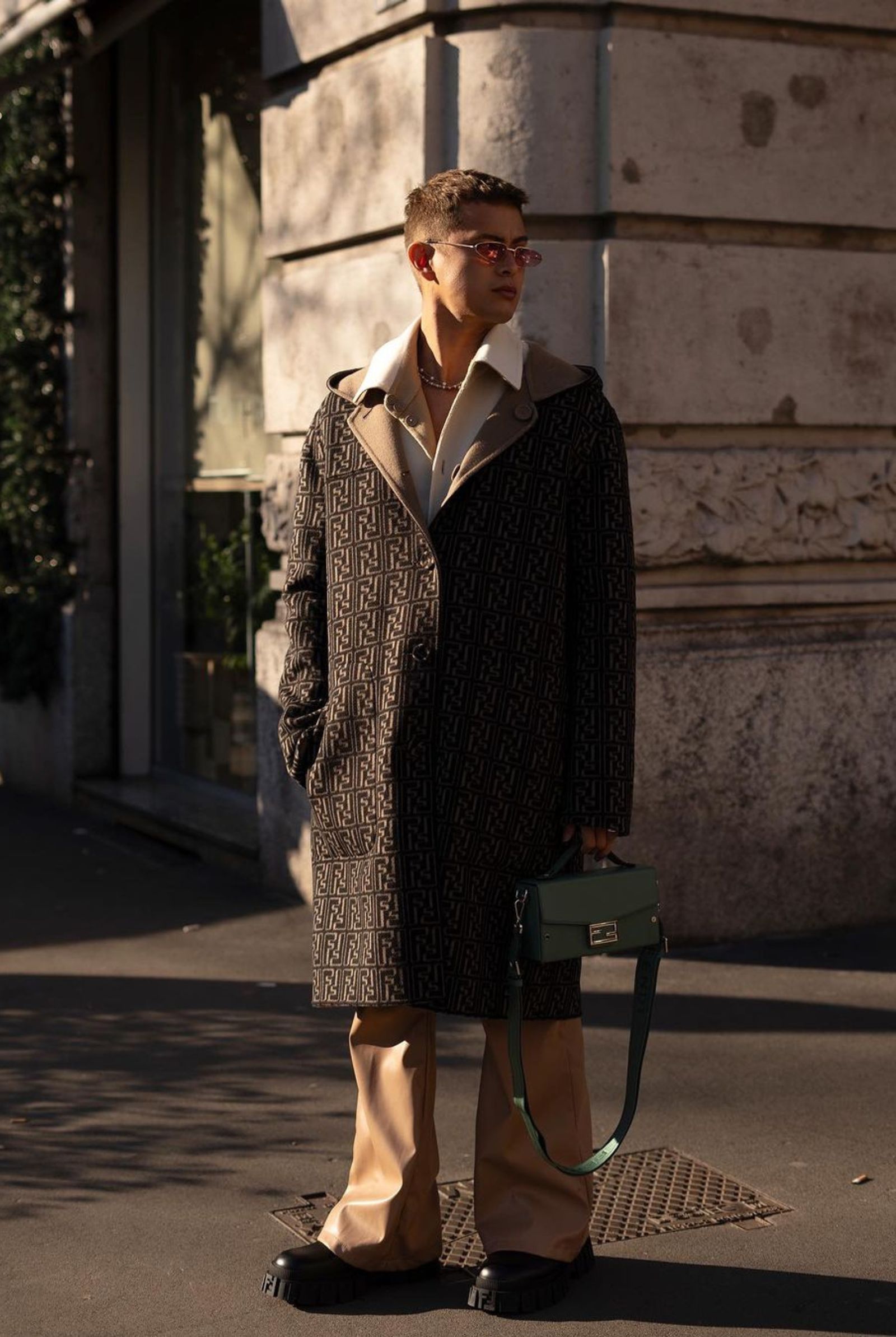 The actor opted for a reversible wool monogram trench and a button-down shirt for the Fendi show