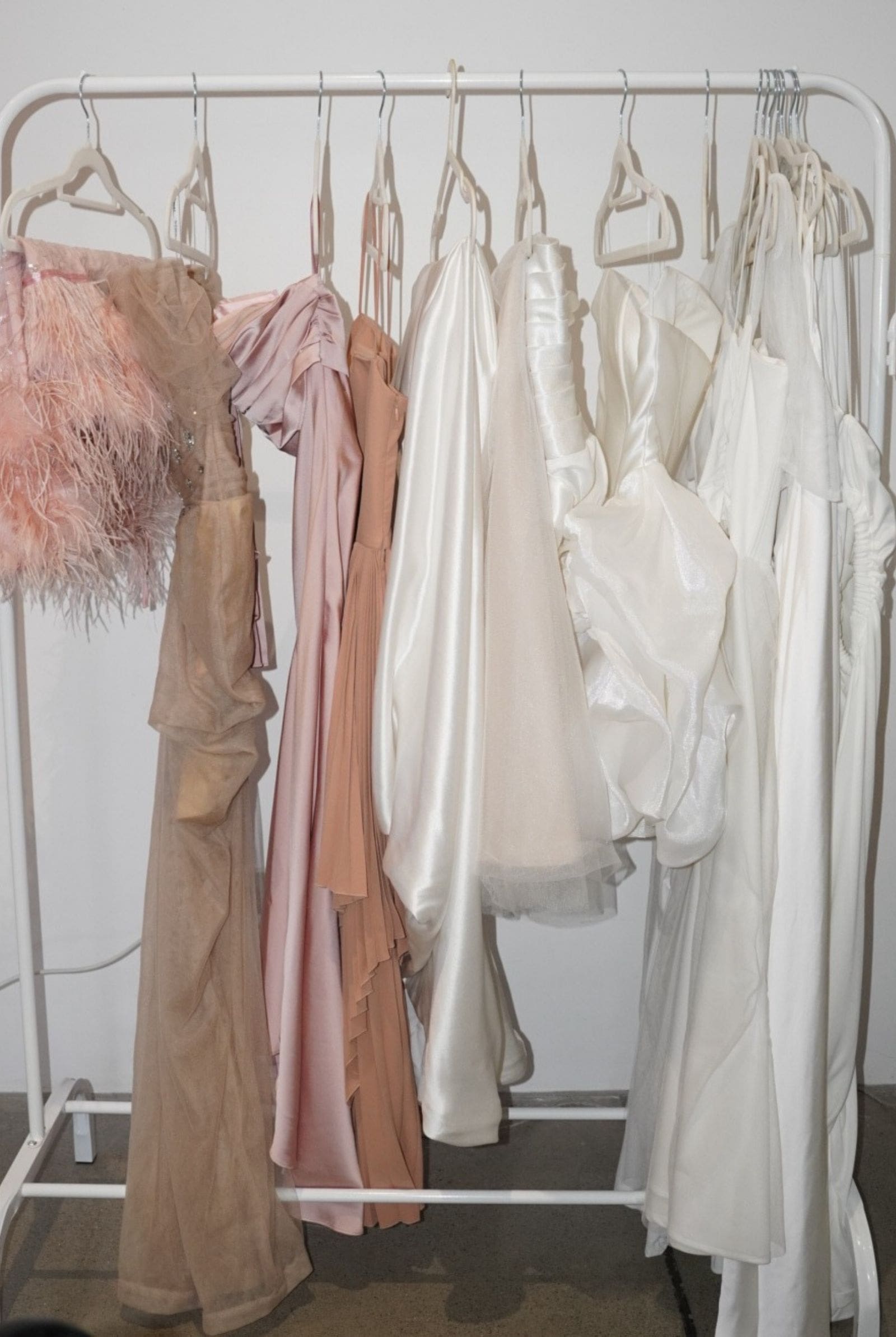 A rack of Aecia's gowns and dresses for rent