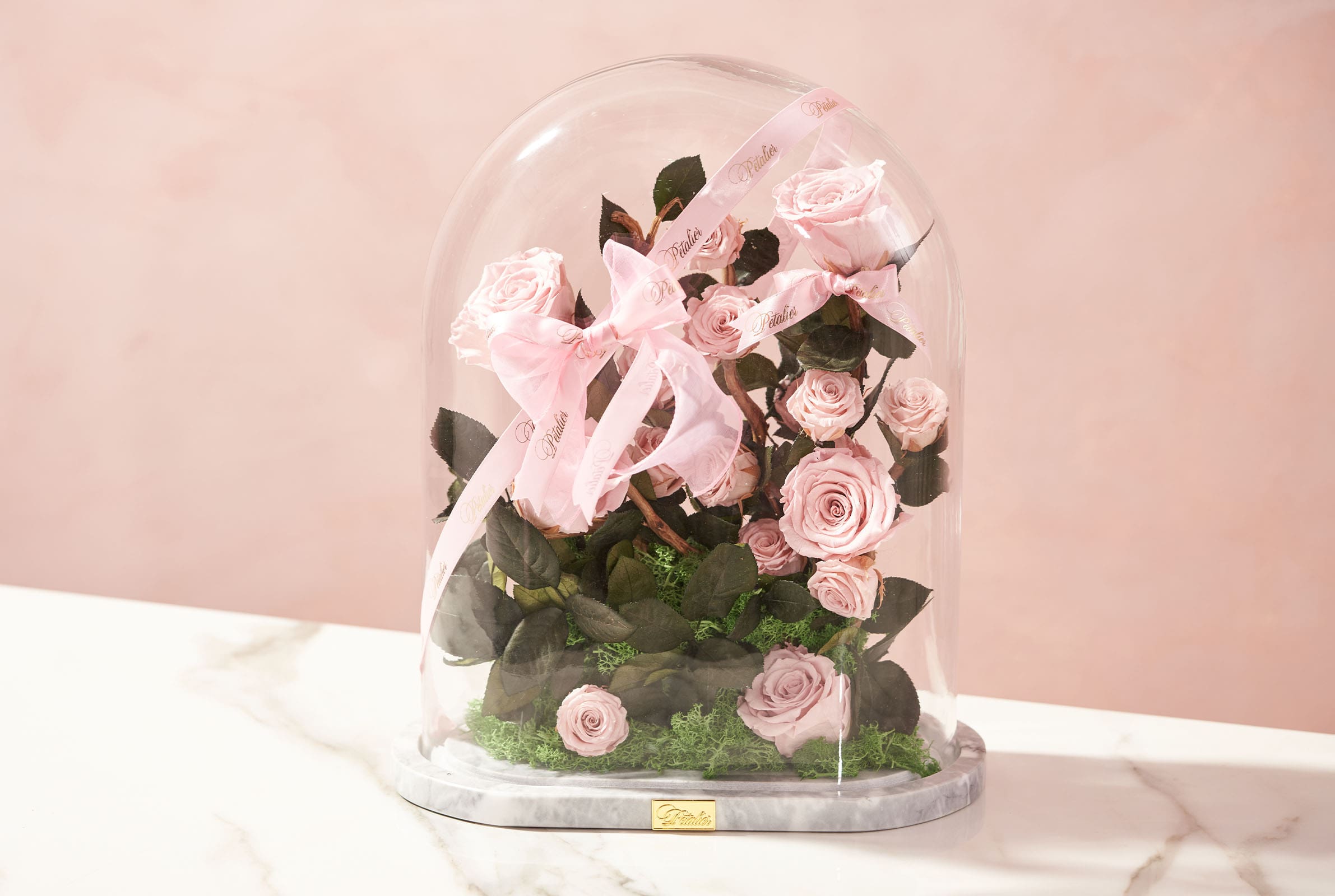 mega-petalier-1 - MEGA A pink arrangement of flowers encased in a dome by Petalier