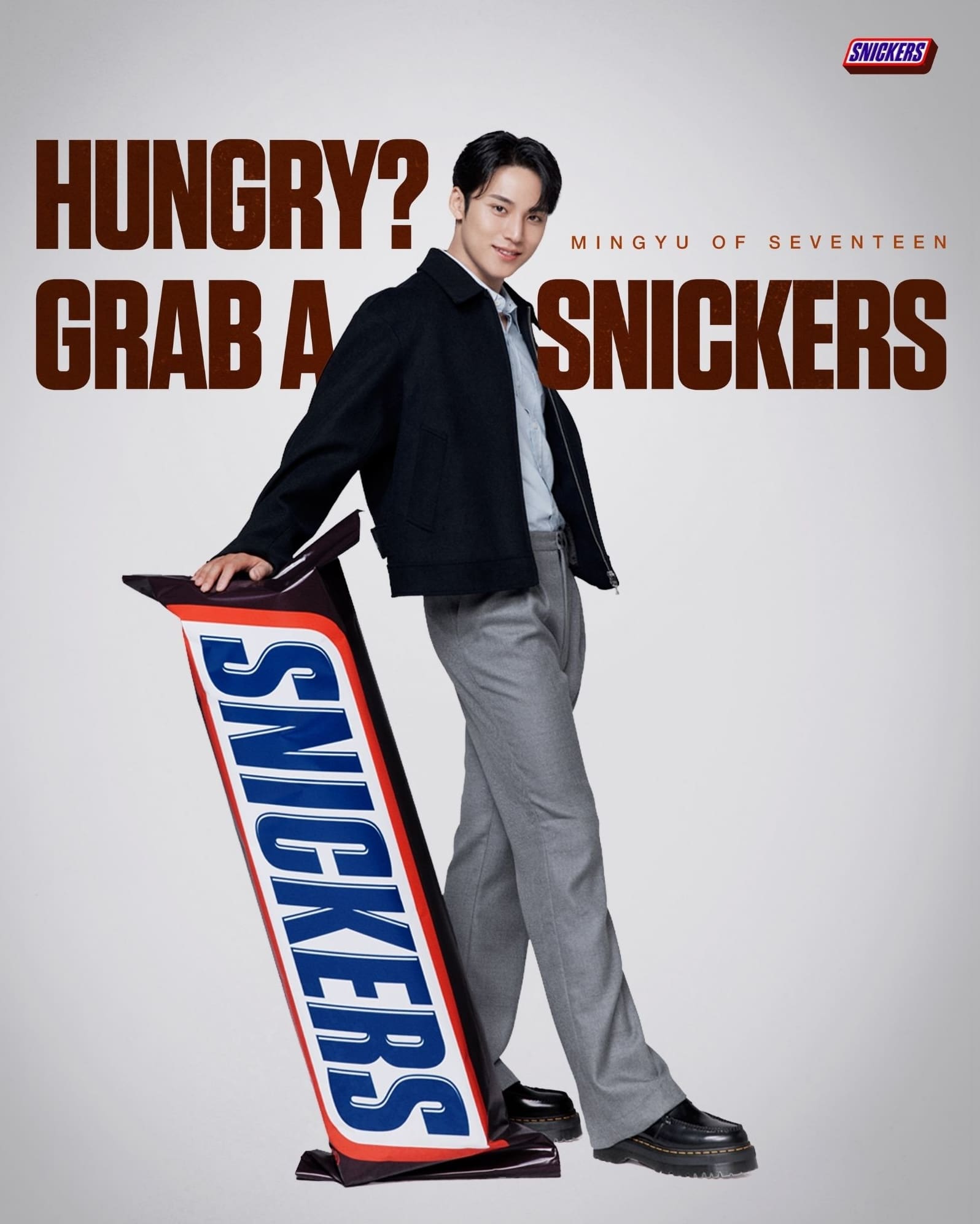 Newest ambassador of Snickers, Mingyu of SEVENTEEN posed with the bar