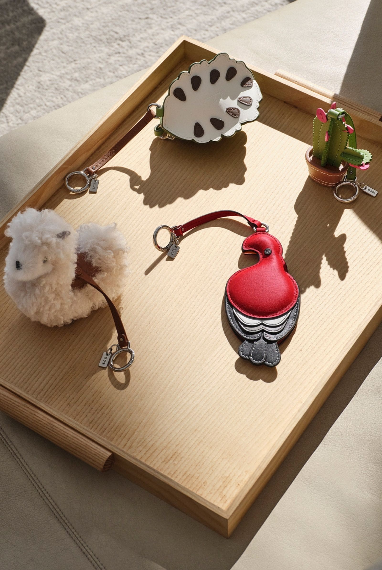 Selection of new bag charms for TUMI's Spring capsule collection