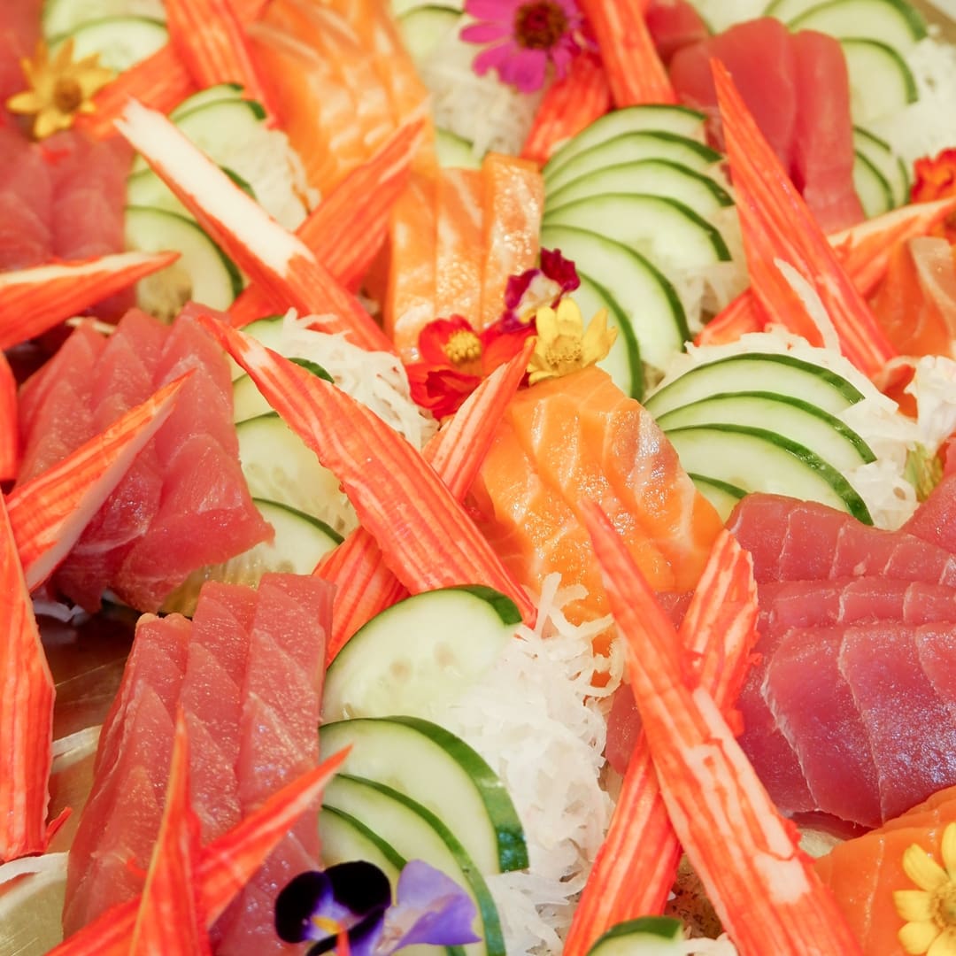 An elegant array of sushi rolls, nigiri, and sashimi