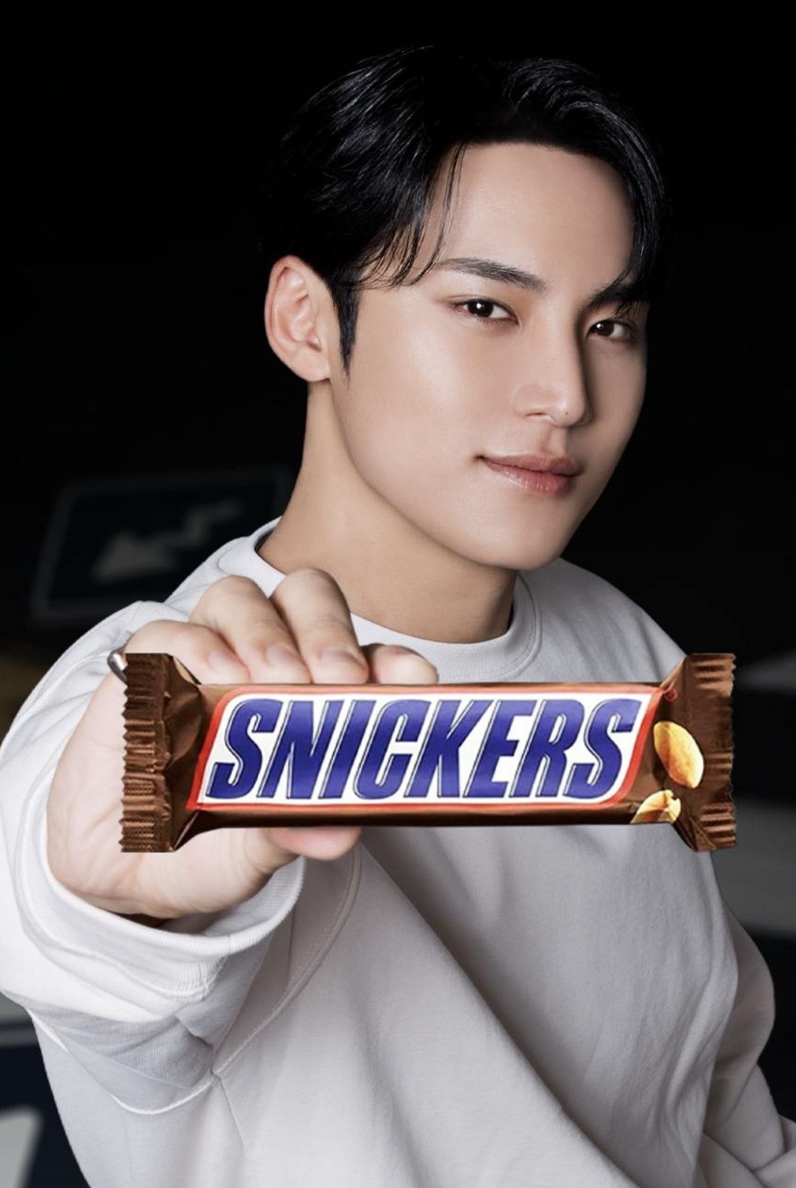 Newest ambassador of Snickers, Mingyu of SEVENTEEN posed with the bar